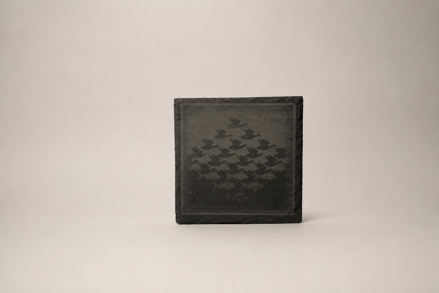 Square slate coaster of geese flying in formation
