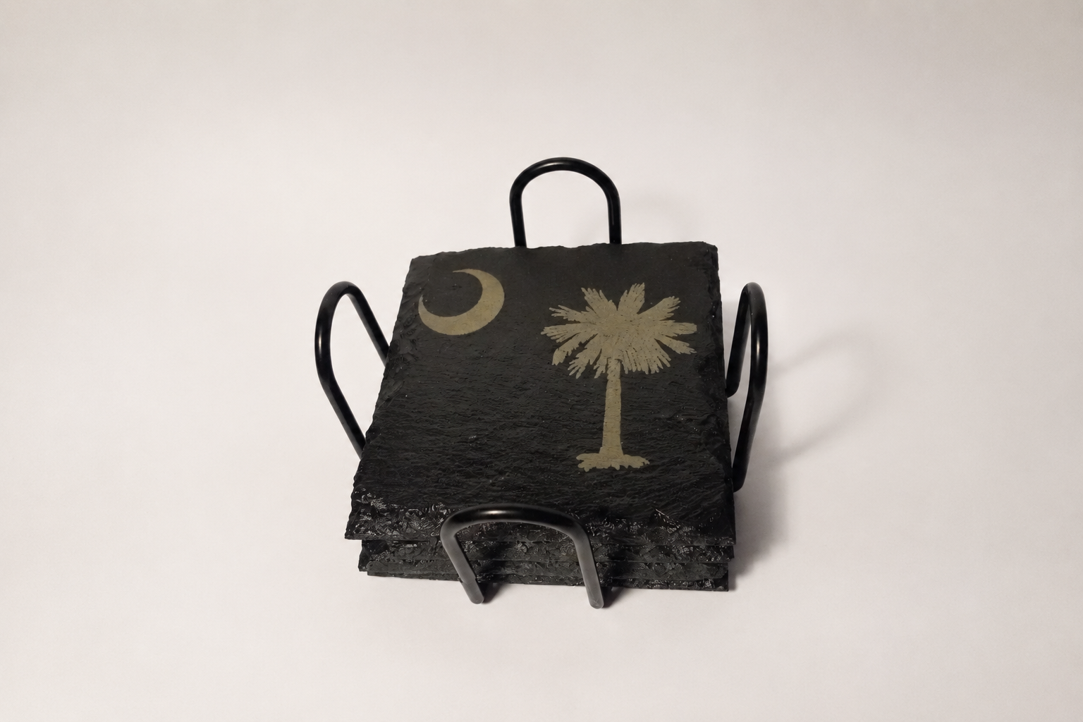 Set of four Palmetto and moon slate coasters with stand