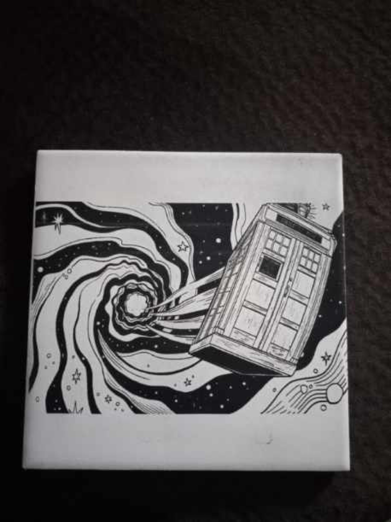 White ceramic tile of a police box flying through a starry time vortex