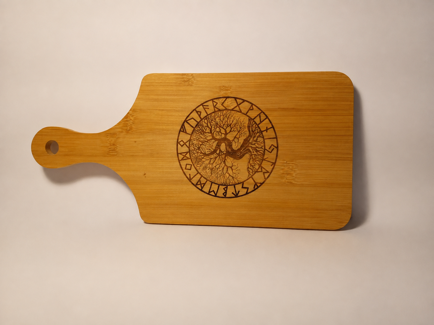 Bamboo serving board engraved with Tree of Life in a rune circle